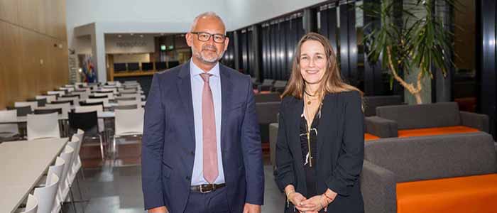 Image of Profs Christopher Loughrey (left) & Lisa Boden (right) standing side by side